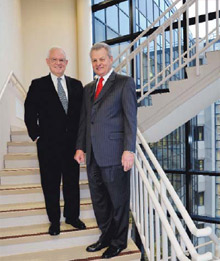  John J. Schiff, Jr., CPCU chairman of the board, with Kenneth W. Stecher, president and chief executive officer.