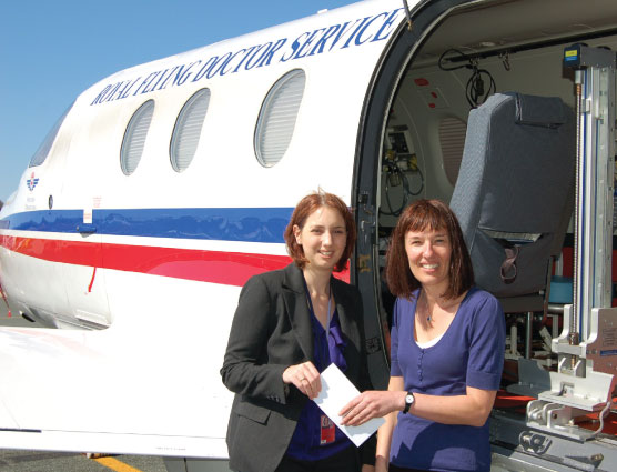 Helen Sayers presents Joeley Petit-Scott with a cheque for the RFDS