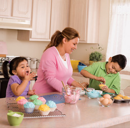 Diana Soto makes cupcakes with her children