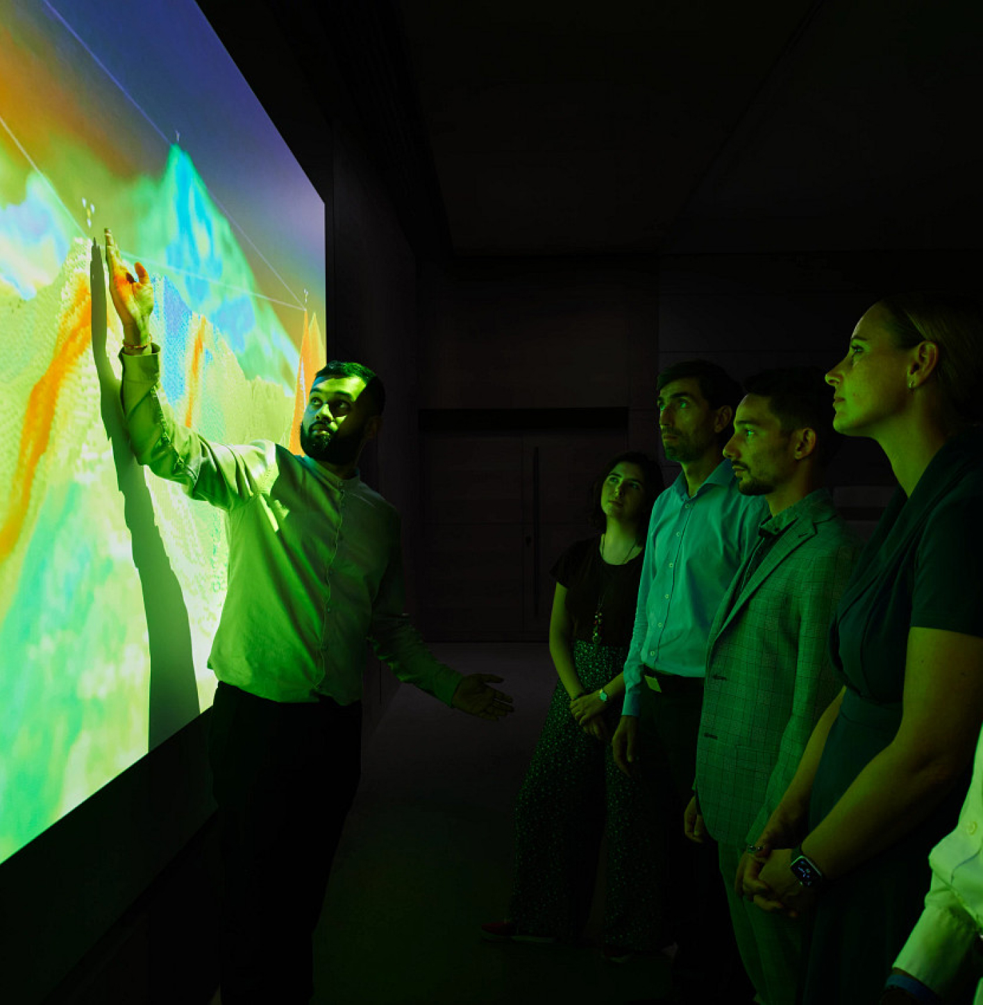 Man giving presentation while people watch